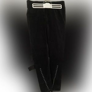 Black velvet pants with button & zipper detail on tapered legs. never worn